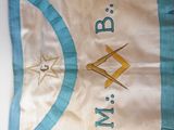 a blue and white banner on a table with other items