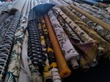 many different types of fabrics laid out on a table