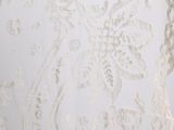 the back of a wedding dress with a lace pattern on it