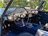 a blue car with a steering wheel and a dashboard