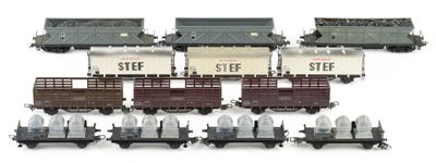 a lot of toy trains that are on a white surface