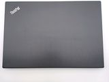 a laptop that is sitting on a white surface