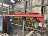 a picture of a machine that is working on a piece of metal