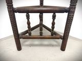 a small wooden chair that is sitting on the floor