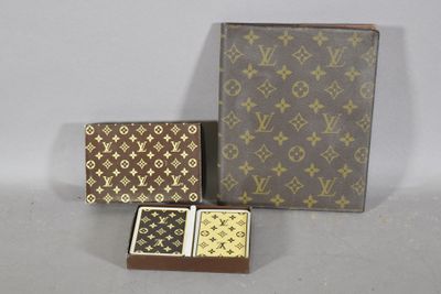 two boxes of playing cards and a box of playing cards on a table