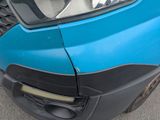 a close up of the front bumper of a blue car