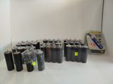 a lot of black trash cans in a white room