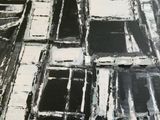 a painting of black and white squares on a black and white background