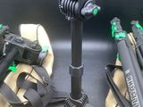a tripod and a camera on a tripod stand in the back of a car
