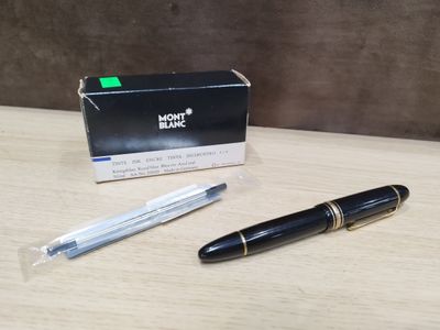 a pen that is sitting on a table next to a box