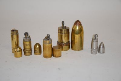 many different types of bullet shells on a white surface