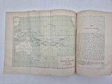 an open book with a map of the world on it