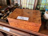 a wooden box with a number on it sitting on a table