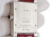 a close up of a wrist watch with a red strap
