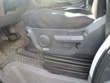 a picture of the inside of a car with the door open