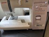 a sewing machine sitting on a table in a room