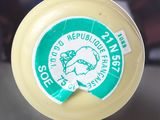a close up of a plastic bottle with a sticker on it