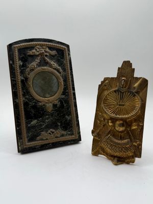 pair of antique brass bookends of a man and a woman