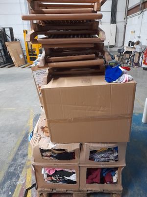 boxes stacked on top of each other on a pallet in a warehouse