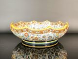 a bowl that is sitting on a table with a reflection