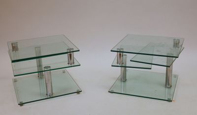 pair of glass side tables with metal legs