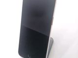 a cell phone that is sitting on top of a stand