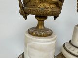 two vases that are sitting on top of each other