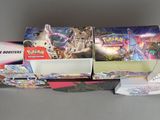 many different types of pokemon cards in the box