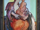 tableau représentant une femme tenant un enfant dans ses bras, dans un cadre noir