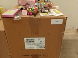 a box with a lot of stuff on it sitting on a pallet