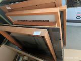a lot of wooden windows that are stacked on top of each other