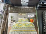 boxes of bedding and comforters for sale in a store