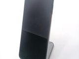 a cell phone that is sitting on top of a stand