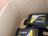 two batteries in a cardboard box on top of a table