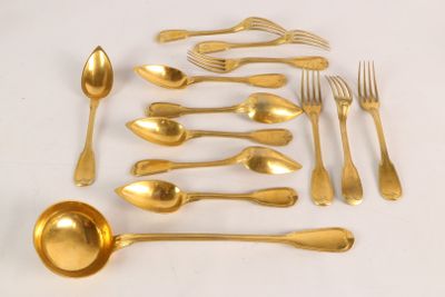 a lot of gold colored spoons and spoons on the table