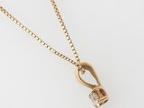 a gold necklace with a diamond pendant on a chain