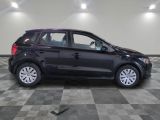 a picture of a black car parked in a garage