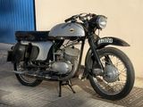 a motorcycle that is parked in front of a building