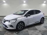 a white car is parked in a room with a checkered floor