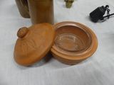 a brown pot with a lid sitting on a table