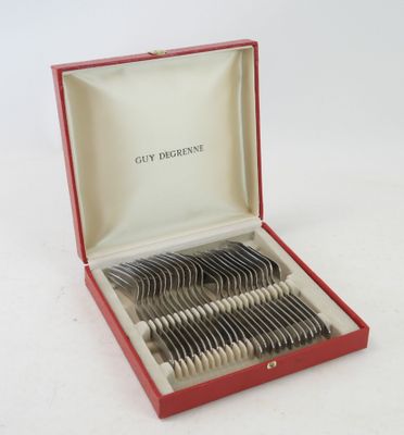silverware in a red box on a white surface