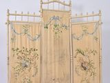 a decorative screen with birds and flowers on it
