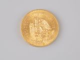 an image of a close up of a gold coin on a white surface