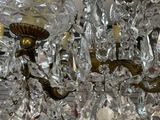 a chandelier that has a lot of glass hanging from it