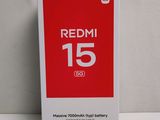 the redmi 15 battery box is open on a white surface
