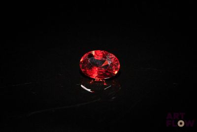 a red diamond on a black surface