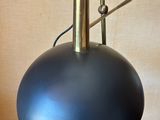 an image of a black lamp on a wooden table