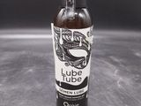 a bottle of liquid sitting on top of a table