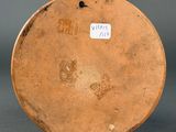 an image of a brown vase with a tag on it
