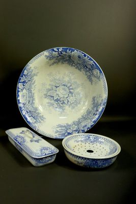 a blue and white bowl and a plate on a table